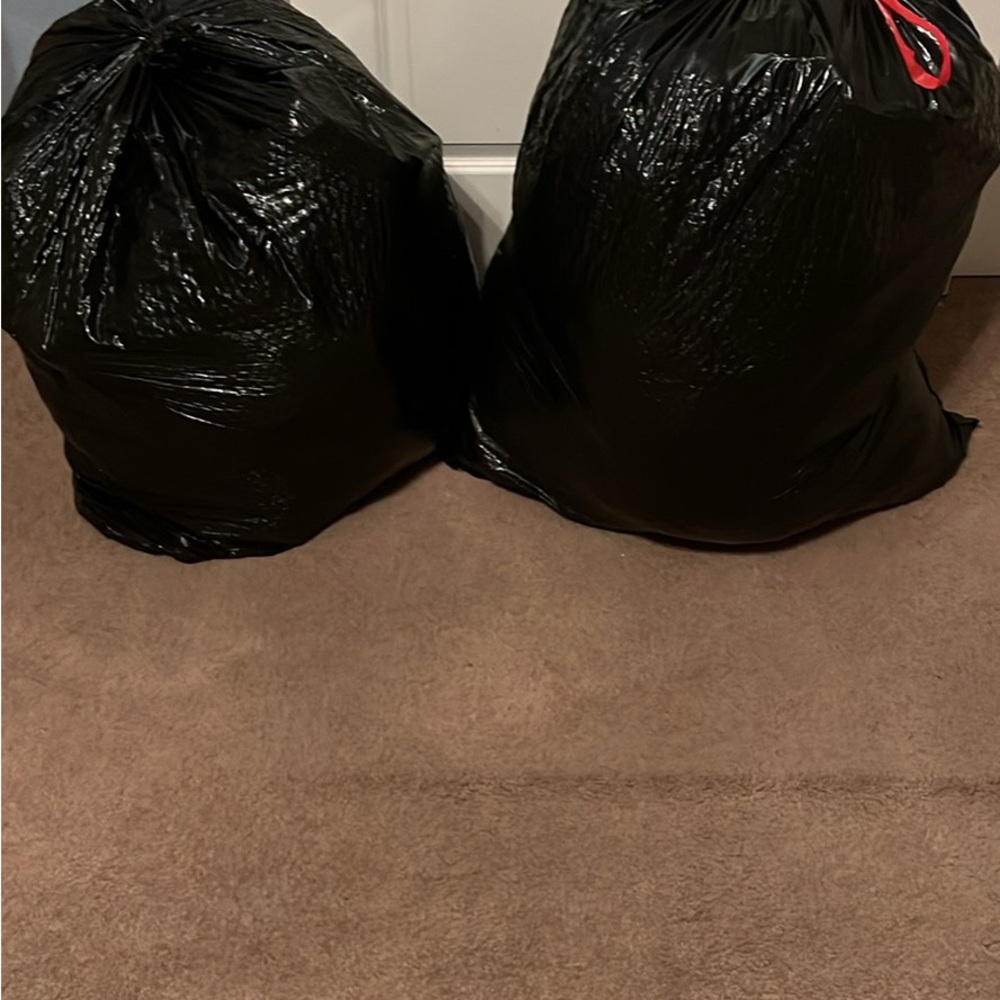 Two huge bags of clothes, one is men’s and the other is women’s!